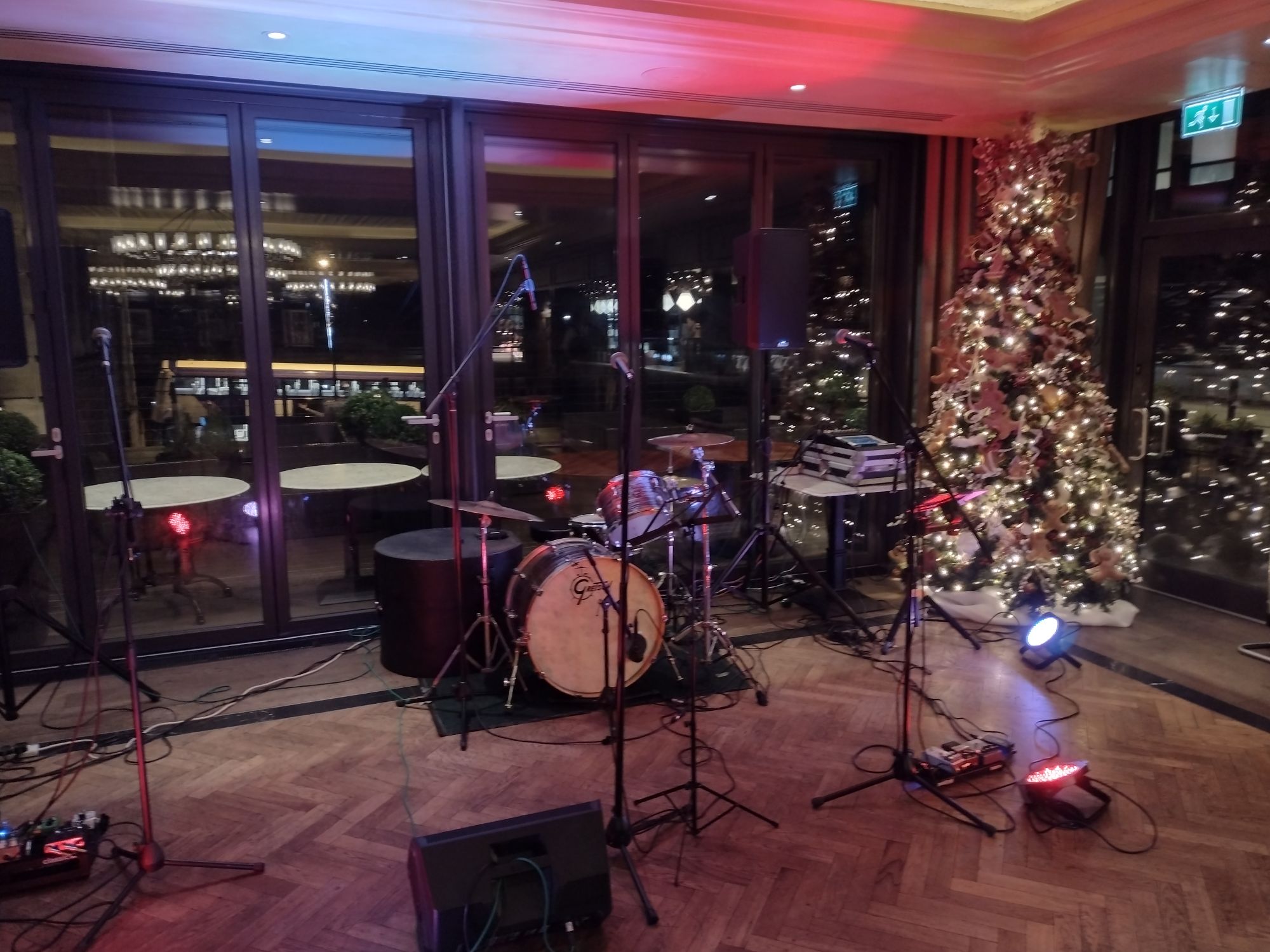 Drum kit in front of a Christmas tree